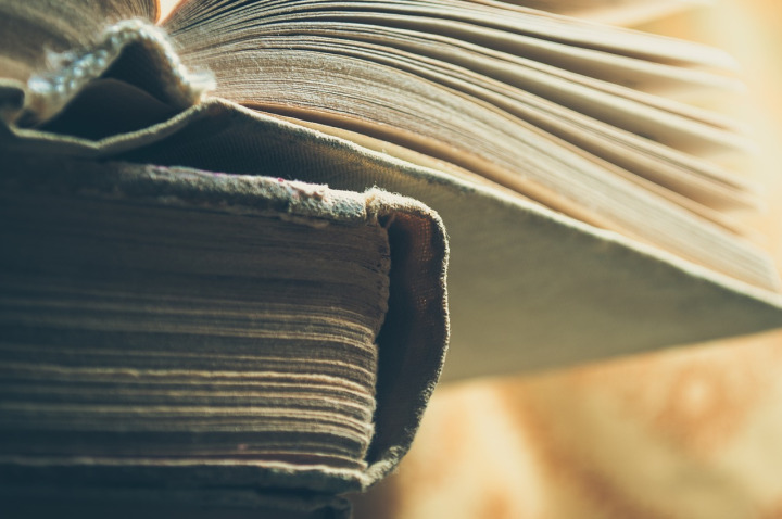 stack of warm-toned vintage books